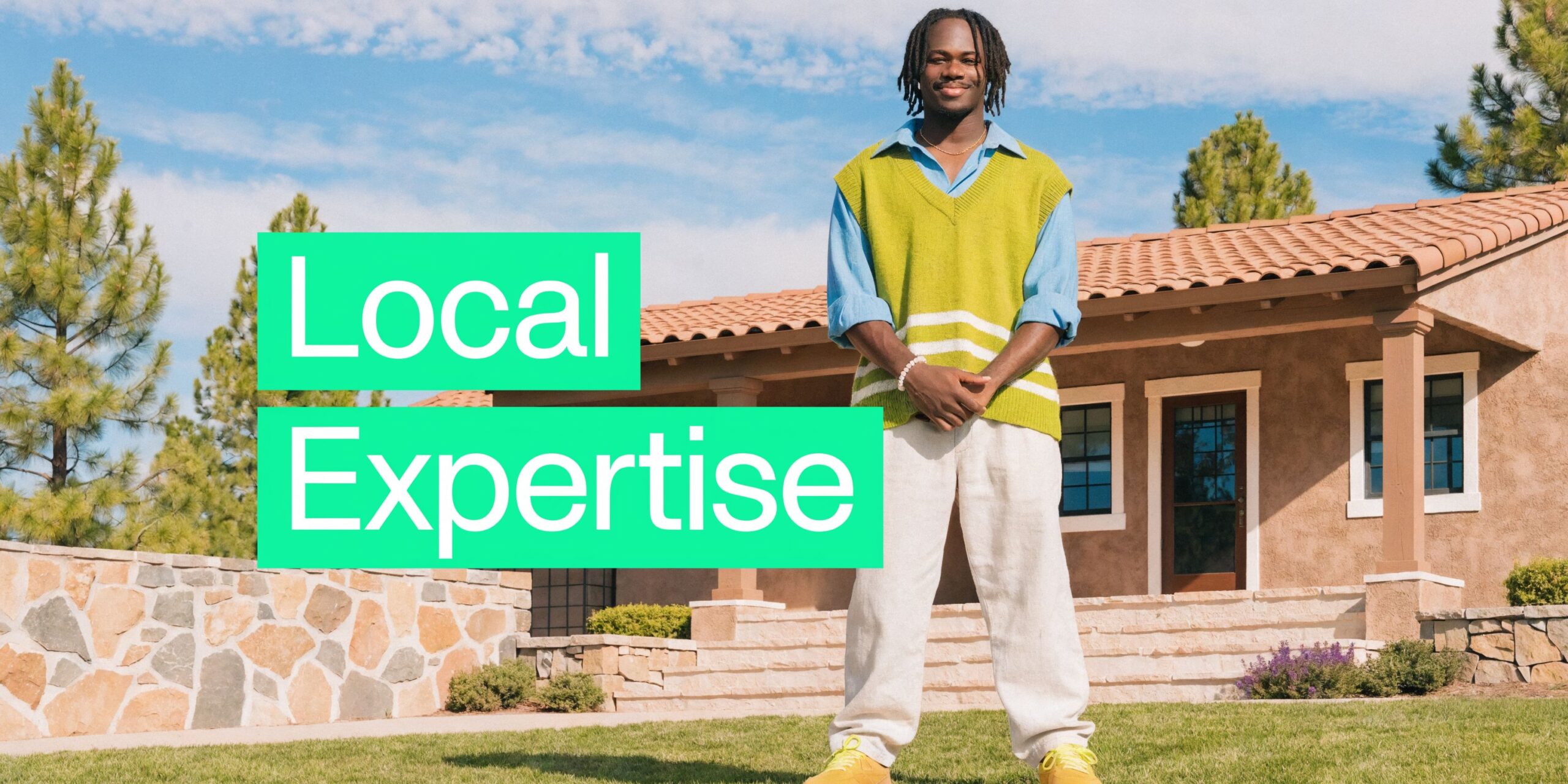 A young man standing in front of a tan house in Pine Canyon, Flagstaff, featuring local expertise text.