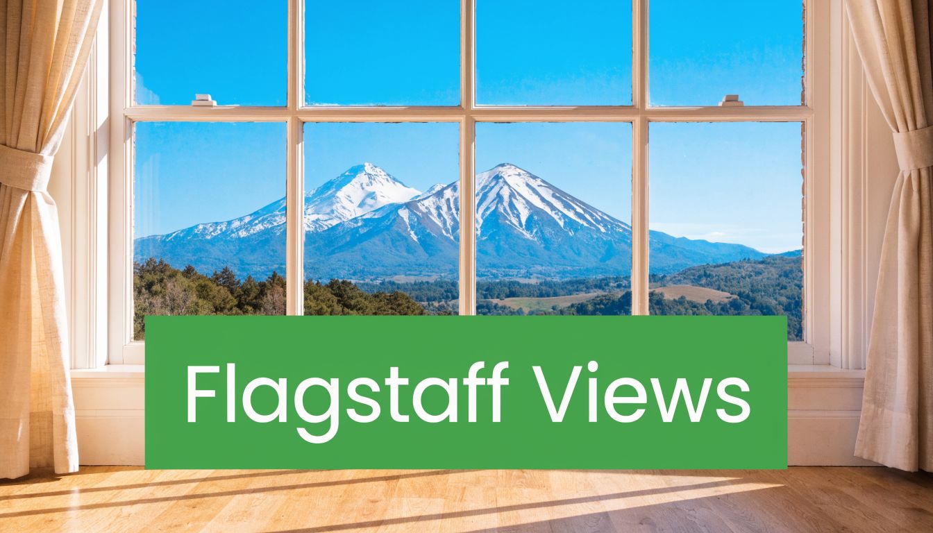 A scenic view of snow-capped mountains in Flagstaff seen through a large, bright home window.