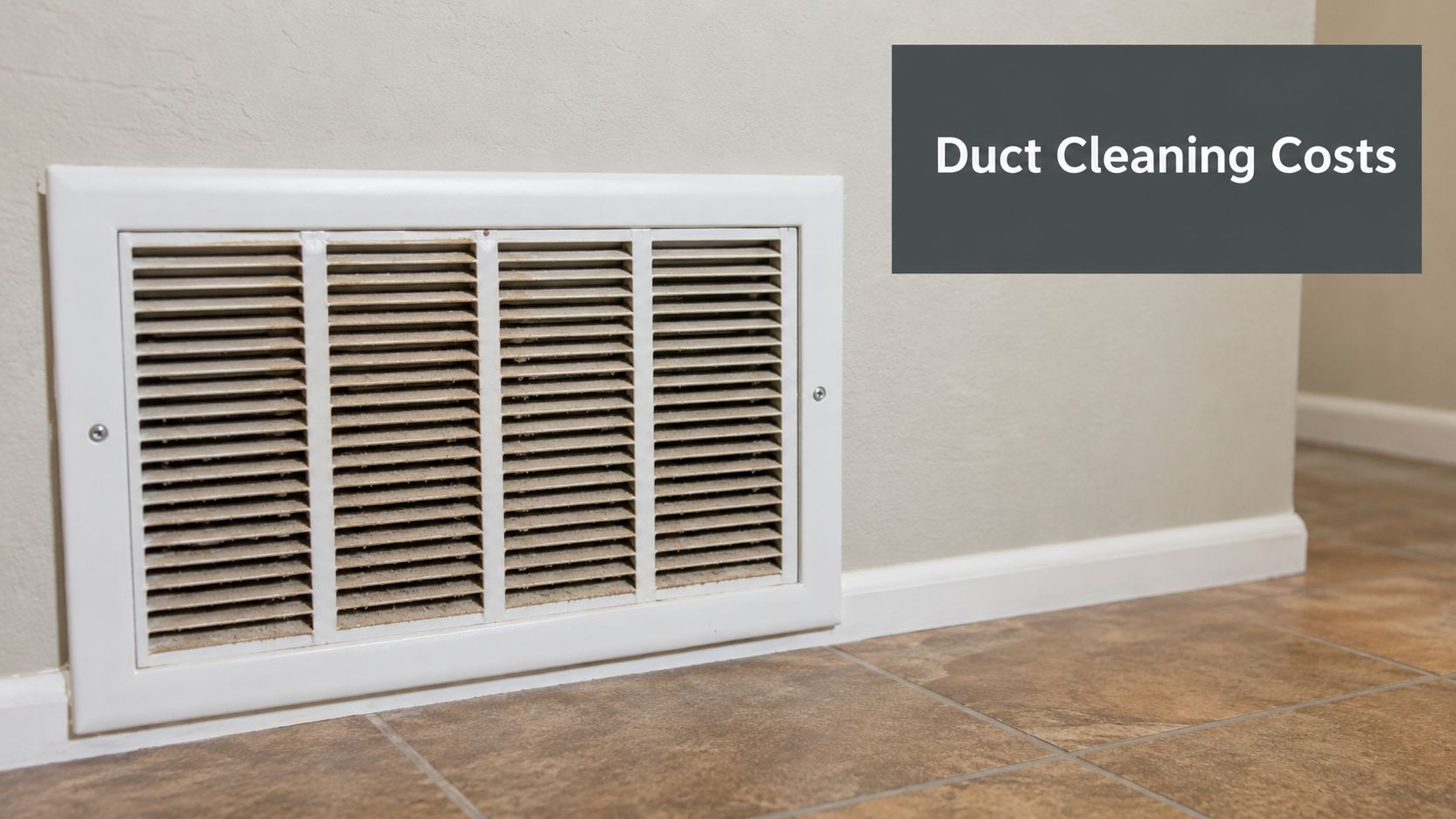 A close up view of a white wall air conditioning duct vent located near the floor.